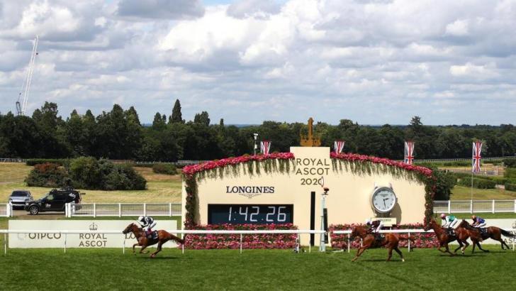 Royal Ascot finish with clock in the background.